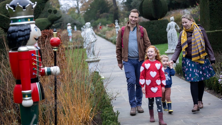Visitors admiring the giant Nutcrackers in the Long Garden